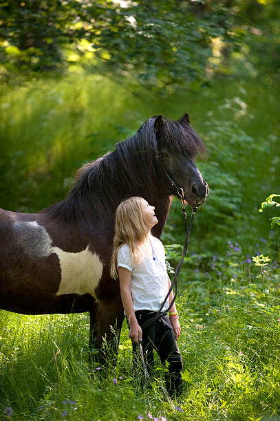 istock young girl with an icelandic pony 162711156