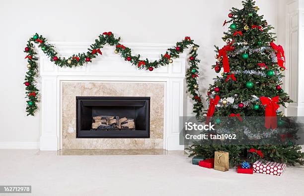 Gas Insert Fireplace In Use During Holidays Stock Photo - Download Image Now - Christmas, Mantelpiece, Fireplace