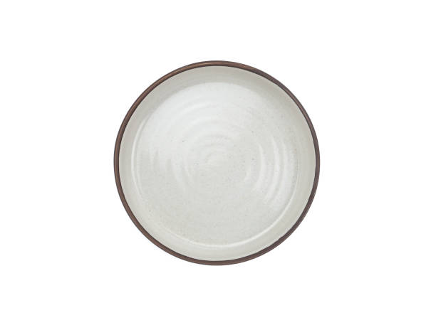 istock Top view, empty light grey round ceramic bowl with brown rim isolated on a white background. 1627130771