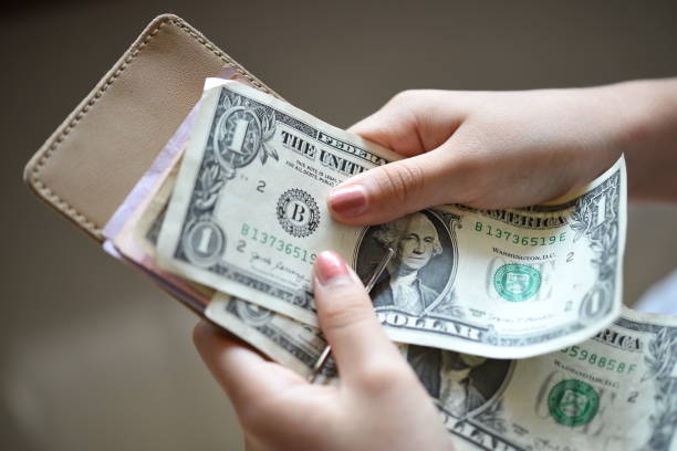 istock One dollar bills in clip wallet 1627138225