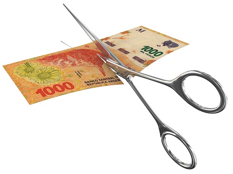 Argentina peso money falling finance crisis cut scissors