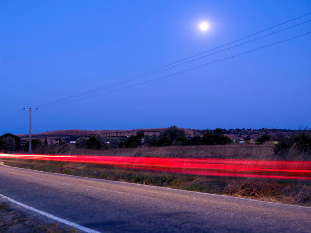 Long exposure photo of traffic on Long exposure photo of traffic on m40 sniper rifle stock pictures, royalty-free photos & images