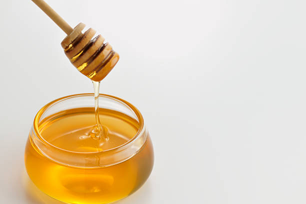 istock Glass honey with sticks 162717060