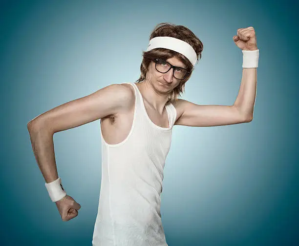 Funny retro sports nerd flexing his muscle over blue background