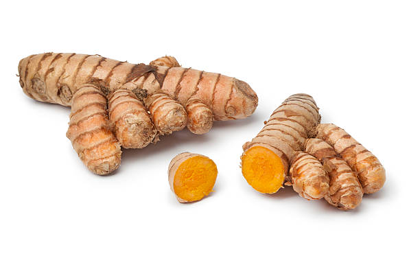 istock Whole and sliced fresh turmeric root isolated on white 162717592
