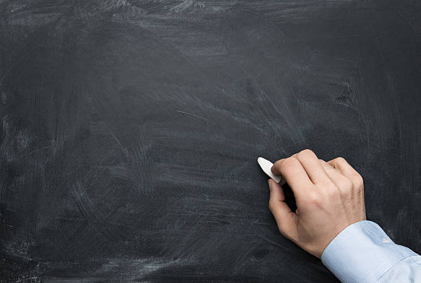 istock Male hand writing on a chalkboard 162719361