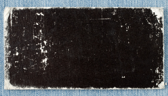 A blank label isolated on blue jeans.