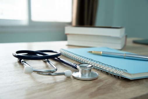 In a hospital setting, the presence of a doctor's physician book and stethoscope carries with it an air of professionalism and dedication to patient care.