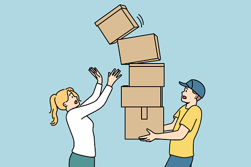 Man courier carries stack of boxes and drops one of parcels standing near woman recipient of order. Clumsy courier risks spoiling goods during delivery due to lack of professionalism