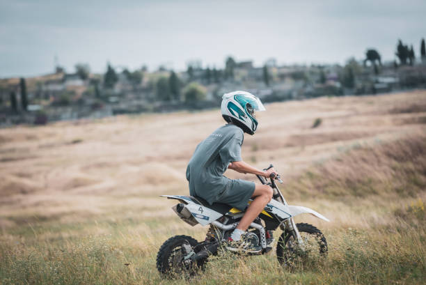 istock Motorcycle racer boy preparing for motocross race. 1627242257