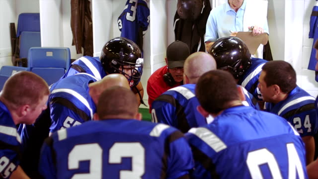 Football Team gets psychs up in the locker room