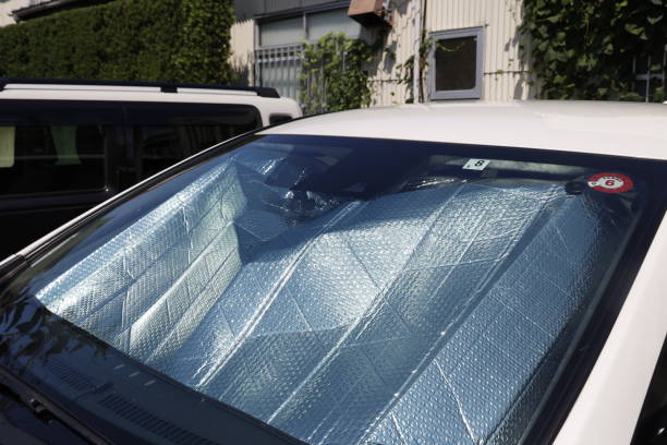 istock A sunshade attached to the windshield of an automobile. 1627256713