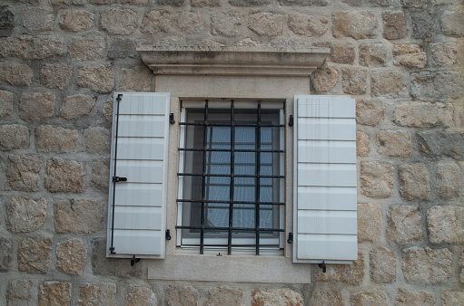 An architectural feature of a medieval building exterior in Alicante, Spain.