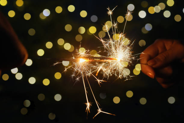 istock Close-up view playing the sparklers at night 1627274865