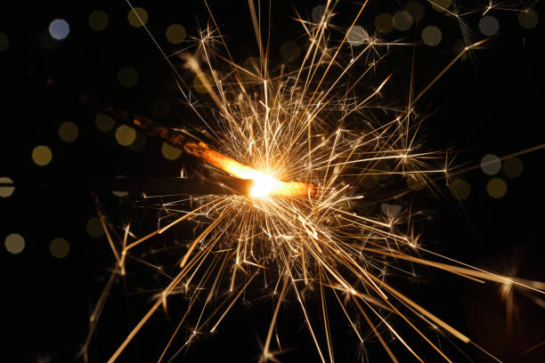 istock Close-up view playing the sparklers at night 1627275114