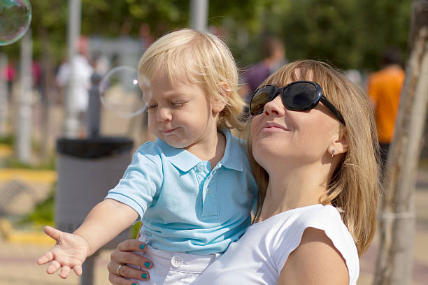 istock Mom and her cute little blond son 162729353