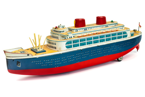 Antique toy cruise ship isolated on a white background