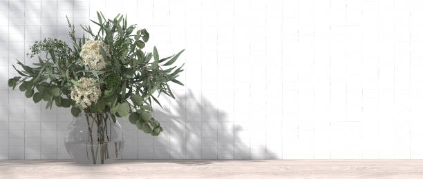 istock White ceramic tile wall inside an empty bathroom. On the wooden counter tops in the bathroom, flower vases, interior design styles, modern style. 3D render 1627297365