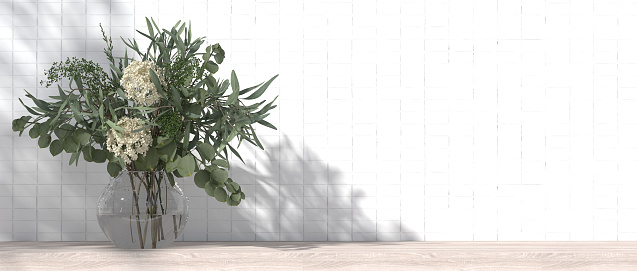 White ceramic tile wall inside an empty bathroom. On the wooden counter tops in the bathroom, flower vases, interior design styles, modern style. 3D render