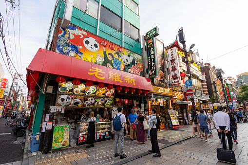 Yokohama, Japan - June 29, 2023 : People at Yokohama Chinatown in Yokohama, Japan. It is Japan's largest Chinatown and one of the most popular tourist destinations in Yokohama, with many Chinese stores and restaurants on the narrow and colorful streets.