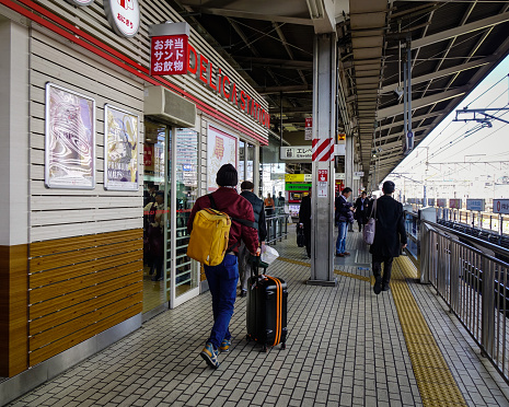 Nagoya, Japan - Dec 3, 2016. People walking at platform of JR station in Nagoya, Japan. Nagoya, capital of Aichi Prefecture, is a manufacturing and shipping hub in Honshu.