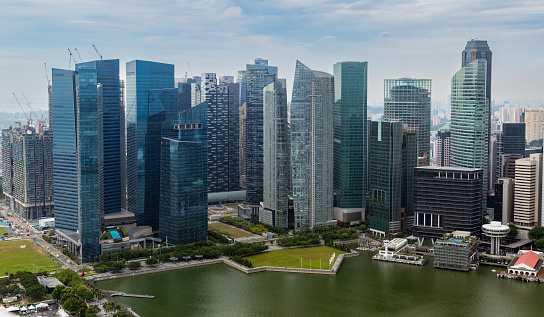Singapore - January 24, 2024.\nFrom above, Singapore's CBD, the global financial hub, reveals prestigious buildings symbolizing its dynamic business scene, bustling with activity and innovation.