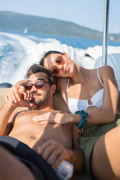istock Couple relax in motor boat together 1627319851