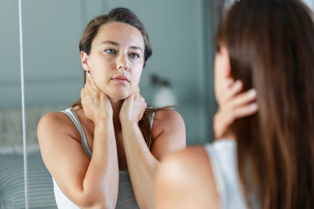 istock Upset woman standing front on mirror and thinking of her problems and depression 1627329238