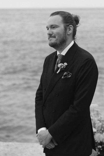 istock Groom relaxes before wedding outdoors 1627330931