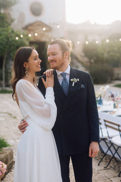istock Bride and groom at wedding ceremony outdoors 1627331582