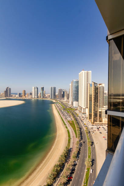 Sharjah, Al Mamzar lake corniche Watefront at the Corniche by Al Mamzar Lake, Sharjah, UAE. sharjah city stock pictures, royalty-free photos & images
