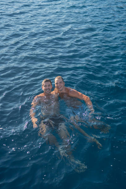 They have dived off a boat and are swimming together