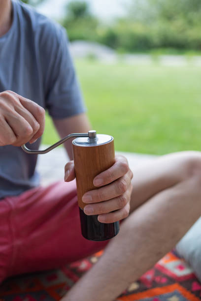 istock Man grinds coffee beans by hand 1627347581