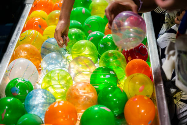 istock water balloon fishing. 1627361470