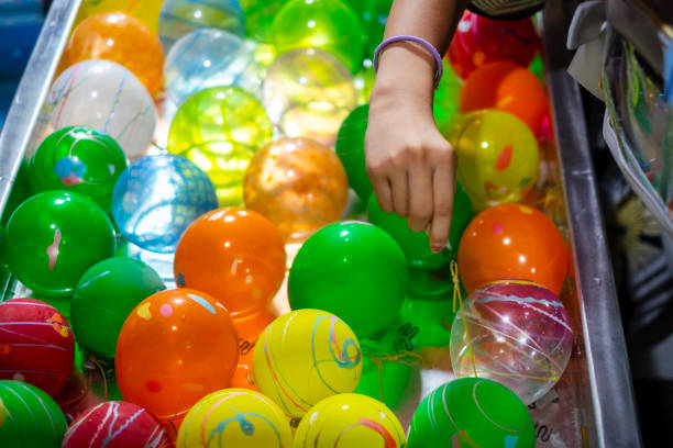 istock water balloon fishing. 1627362110