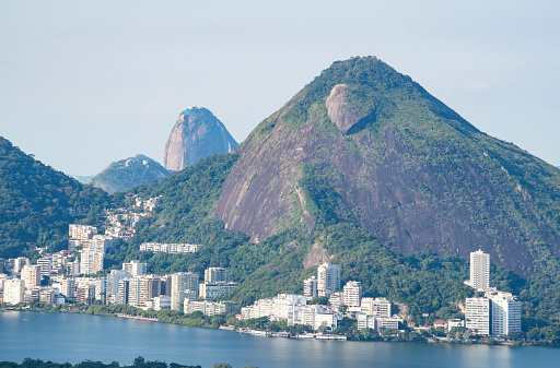Rio de Janeiro, Brazil: the postcard skyline of Rio de Janeiro seen from Rocinha, the most famous favela of the city, with view of mountains, skyscrapers, lagoon, Guanabara Bay and Atlantic Ocean