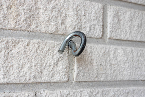 A metal spiral hook on the wall