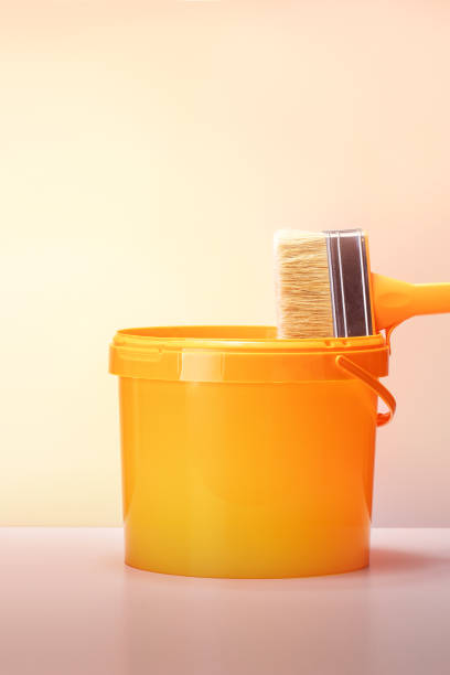 istock Paint bucket and paint brush on the table. renovation concept. 1627399341