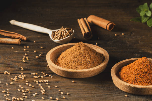 istock Various spices in cork saucers on a wooden kitchen table 1627407469
