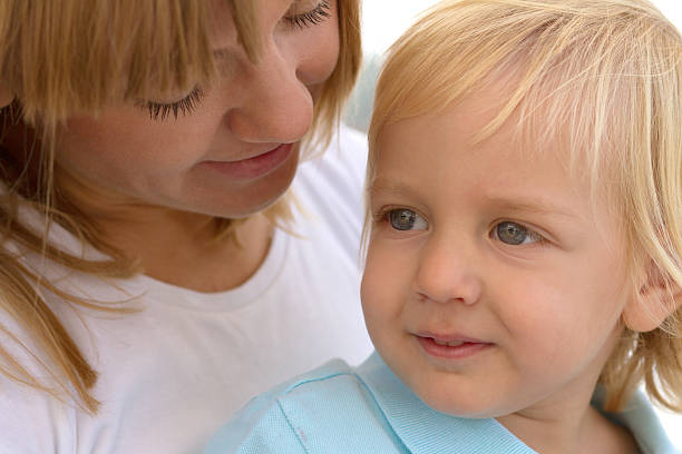 istock Mom and her cute little blond son 162740869