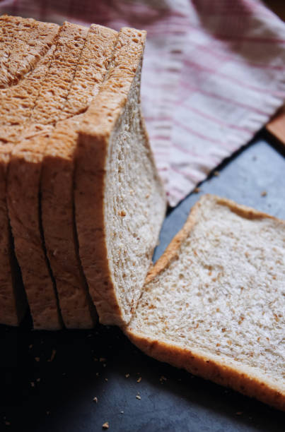 istock Sliced whole wheat bread on the wooden board 1627429090