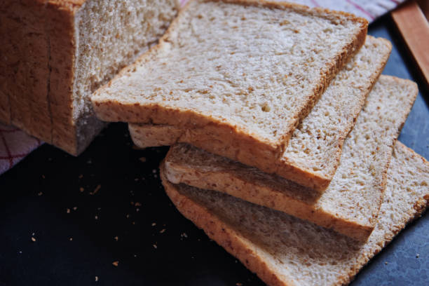 Sliced whole wheat bread on the wooden board