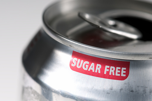 The phrase Sugar Free printed in red on a soft drink can