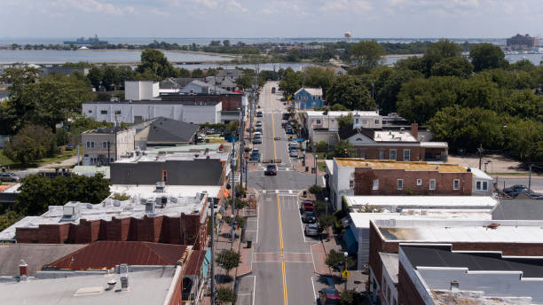 istock Industrial District along E Mellen Str in Phoebus, Hampton, VA. Old military ship on the horizon. Aerial view 1627556367