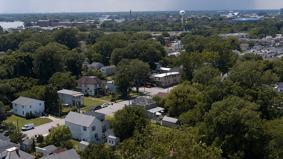 Tree-lined neighborhood in Phoebus of Virginia. E Mellen Street with single family houses in Hampton, VA