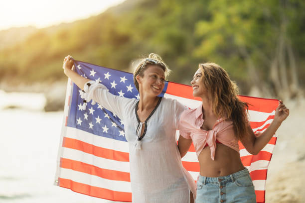 istock Two Women With US National Flag 1627560298