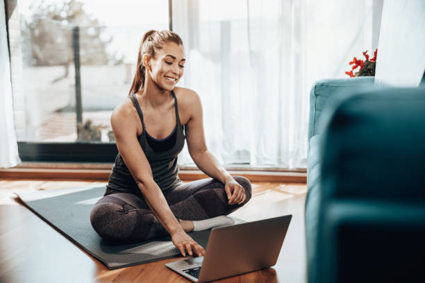 istock Woman Doing Online Workout At Home 1627571597