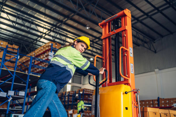 istock Warehouse worker working in warehouse storage. Foreman or worker work at factory site check up products in site. Inventory worker working in  factory Storehouse 1627584292