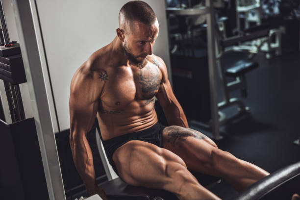 istock Man Doing Training On Machine For His Leg Muscle At The Gym 1627584834