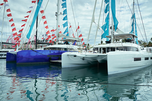Port Canto, Cannes, Catamarans at the pier during Cannes Yachting Festival 2022.
